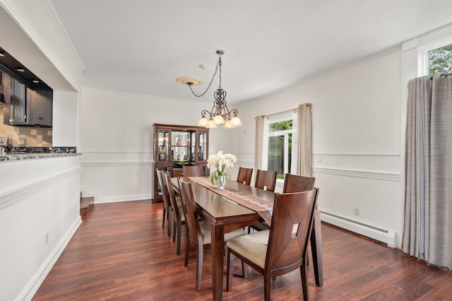 12 Drew Ln, Laconia, NH 03246 - dining space with a baseboard heating unit, a chandelier, dark wood-style flooring, and ornamental molding