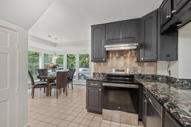 12 Drew Ln, Laconia, NH 03246 - kitchen featuring stainless steel range with electric stovetop, under cabinet range hood, light tile patterned floors, dark stone counters, and tasteful backsplash