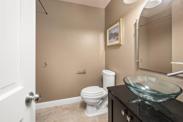 12 Drew Ln, Laconia, NH 03246 - bathroom with toilet, vanity, and baseboards