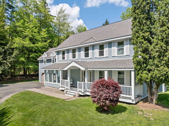 12 Drew Ln, Laconia, NH 03246 - view of front of property with covered porch, roof with shingles, and a front yard