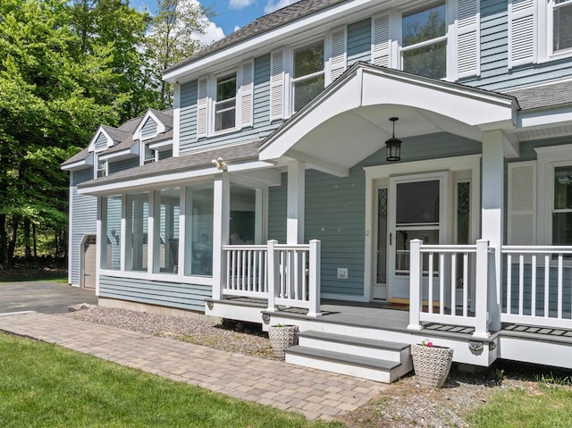 12 Drew Ln, Laconia, NH 03246 - view of front facade with a porch and a shingled roof