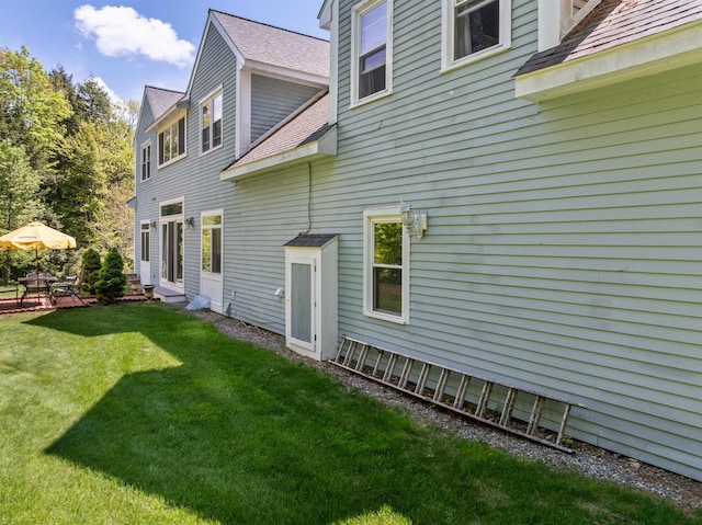 12 Drew Ln, Laconia, NH 03246 - rear view of property featuring a lawn and a shingled roof