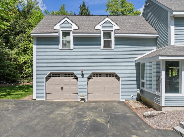 12 Drew Ln, Laconia, NH 03246 - garage with asphalt driveway