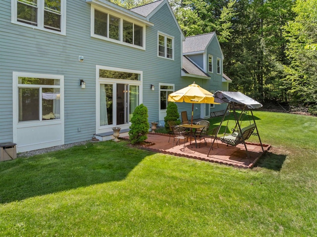 12 Drew Ln, Laconia, NH 03246 - back of house featuring a shingled roof, a patio, and a yard