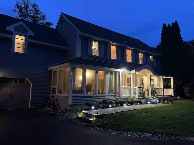 12 Drew Ln, Laconia, NH 03246 - view of front of home featuring a porch, an attached garage, and a front yard