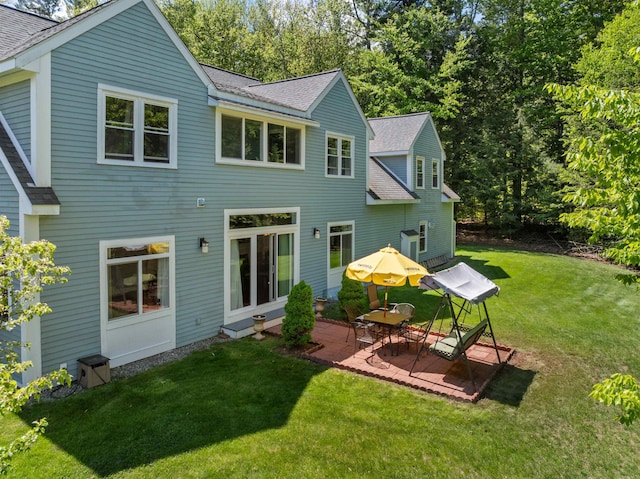 12 Drew Ln, Laconia, NH 03246 - back of house featuring a shingled roof, a patio, and a yard