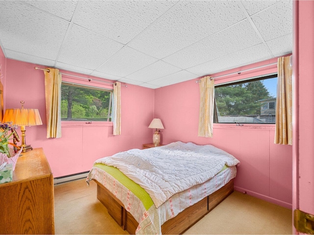 37 Dickinson Dr, Northfield, VT 05664 - carpeted bedroom featuring baseboard heating, multiple windows, and a paneled ceiling
