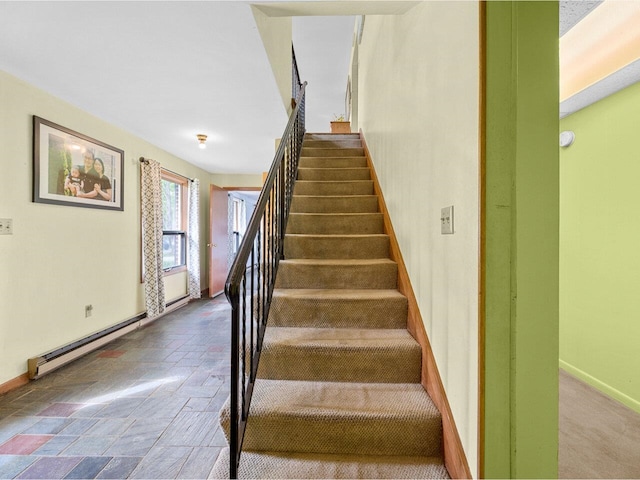37 Dickinson Dr, Northfield, VT 05664 - staircase featuring a baseboard heating unit, baseboards, and stone finish floors