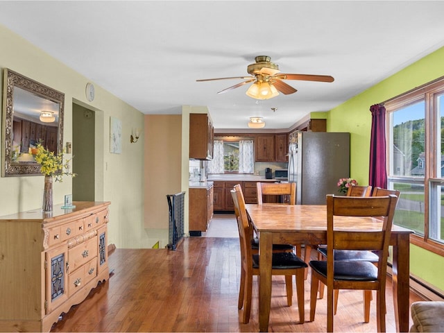 37 Dickinson Dr, Northfield, VT 05664 - dining area featuring healthy amount of natural light, light wood finished floors, and a ceiling fan