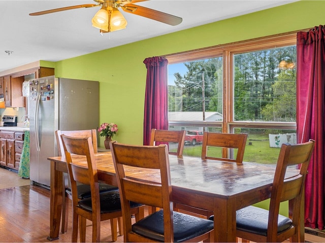 37 Dickinson Dr, Northfield, VT 05664 - dining space featuring ceiling fan, a baseboard heating unit, and light wood finished floors