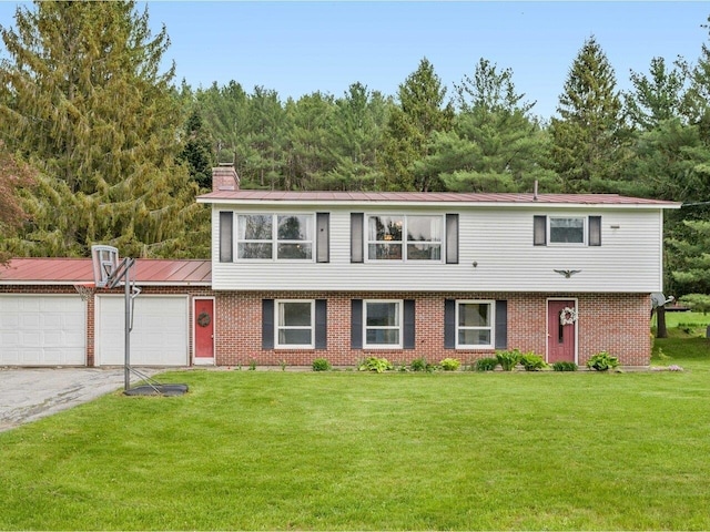 37 Dickinson Dr, Northfield, VT 05664 - view of front facade featuring a garage, a chimney, a front yard, driveway, and brick siding