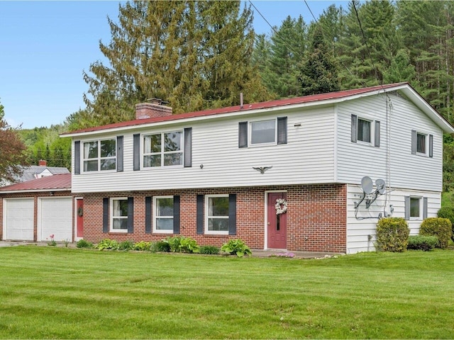 37 Dickinson Dr, Northfield, VT 05664 - view of front of home featuring an attached garage, a front lawn, a chimney, and brick siding