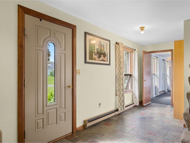 37 Dickinson Dr, Northfield, VT 05664 - foyer featuring baseboard heating, baseboards, and stone finish floors