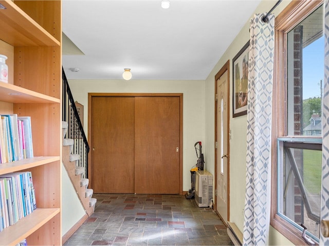 37 Dickinson Dr, Northfield, VT 05664 - entrance foyer featuring stone tile floors and stairway
