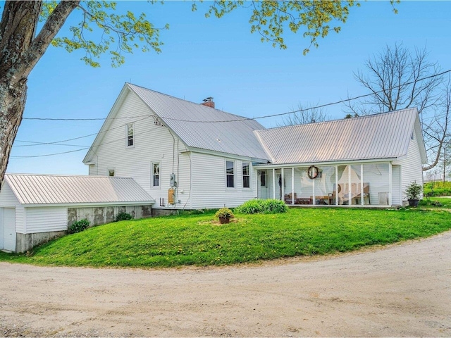 183 Morrie Rd, Washington, VT 05675 - view of front facade with metal roof, a front lawn, and a chimney