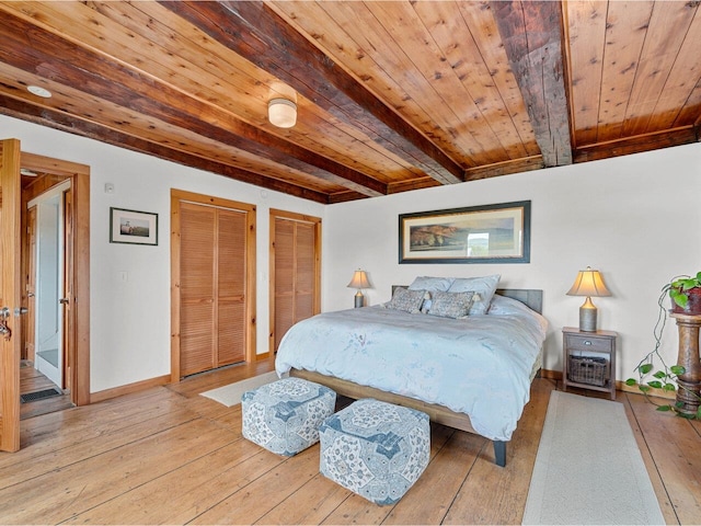 183 Morrie Rd, Washington, VT 05675 - bedroom with wood ceiling with exposed beams, two closets, light wood-type flooring, and baseboards