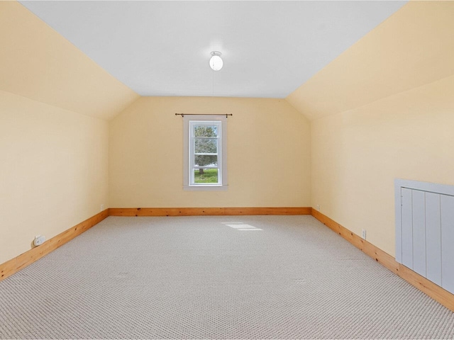 183 Morrie Rd, Washington, VT 05675 - additional living space with lofted ceiling, baseboards, and light carpet