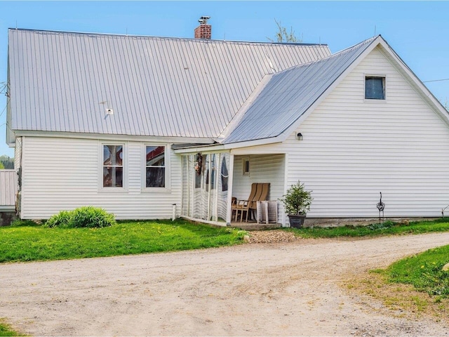 183 Morrie Rd, Washington, VT 05675 - back of house featuring metal roof, a chimney, and dirt driveway