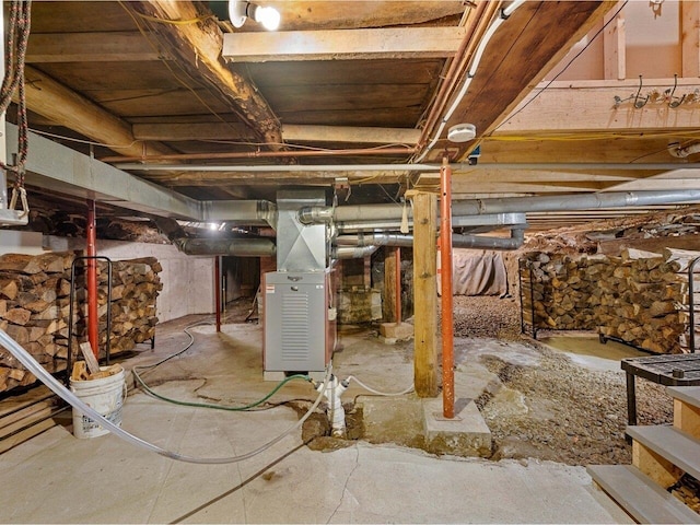 183 Morrie Rd, Washington, VT 05675 - unfinished basement featuring heating unit
