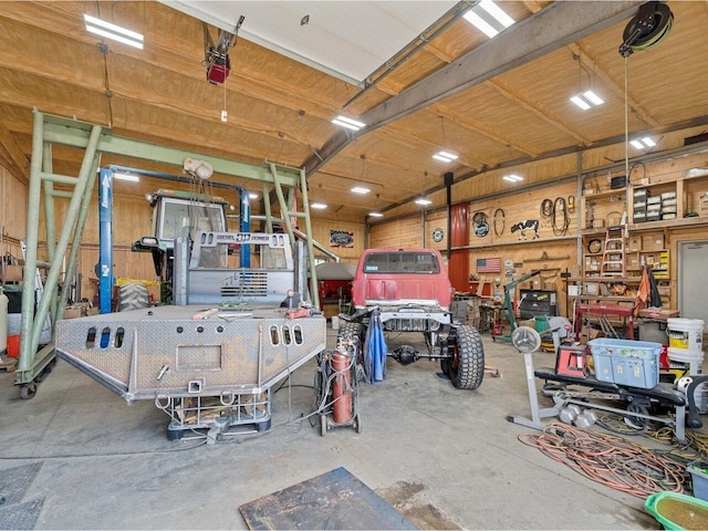 183 Morrie Rd, Washington, VT 05675 - garage with a workshop area and a garage door opener
