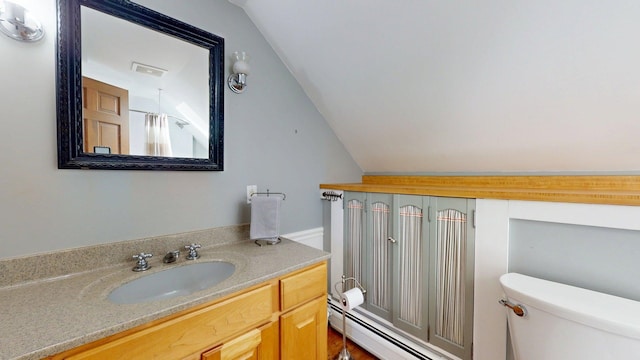 825 S End Rd, North Hero, VT 05457 - full bathroom featuring toilet, lofted ceiling, vanity, and a shower with shower curtain