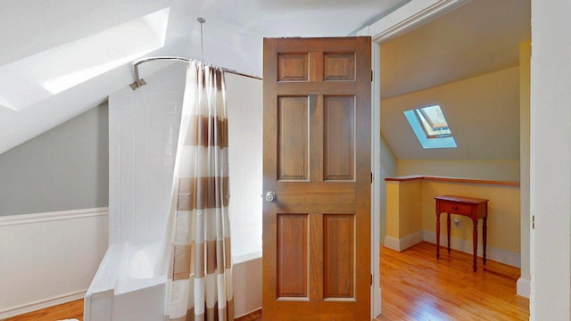825 S End Rd, North Hero, VT 05457 - bonus room with a skylight, vaulted ceiling, and light wood-style flooring