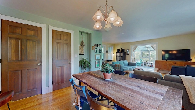 825 S End Rd, North Hero, VT 05457 - dining area featuring a chandelier and light wood-type flooring
