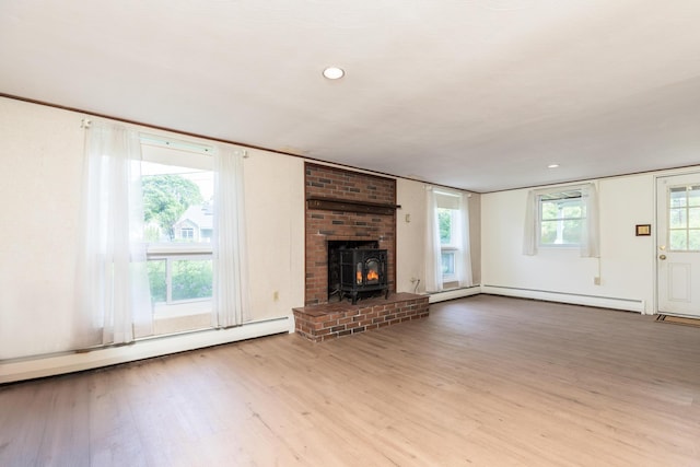 18 Riverdale Ave, Dover, NH 03820 - unfurnished living room featuring wood finished floors, baseboard heating, and recessed lighting