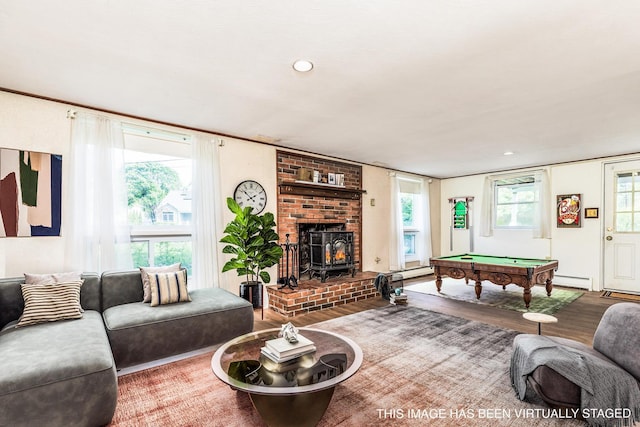 18 Riverdale Ave, Dover, NH 03820 - living area with billiards table, a baseboard heating unit, wood finished floors, and healthy amount of natural light