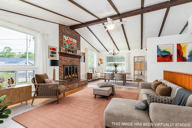 18 Riverdale Ave, Dover, NH 03820 - living room with a chandelier, wood finished floors, a fireplace, and ceiling fan