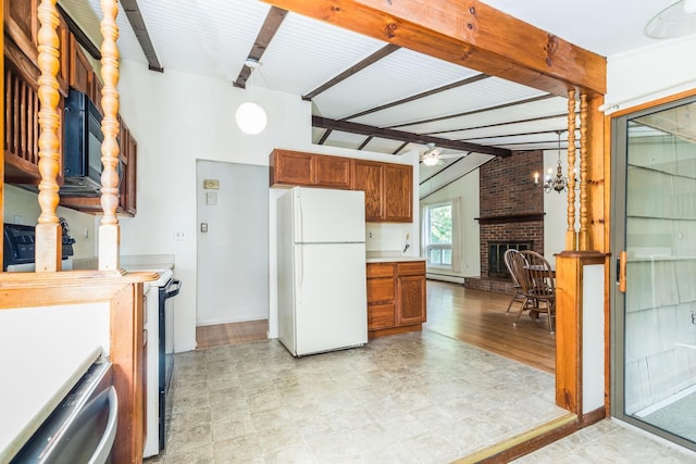 18 Riverdale Ave, Dover, NH 03820 - kitchen featuring freestanding refrigerator, range with electric cooktop, light countertops, and a fireplace