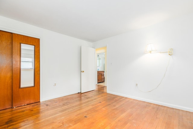 18 Riverdale Ave, Dover, NH 03820 - spare room featuring light wood-type flooring and baseboards