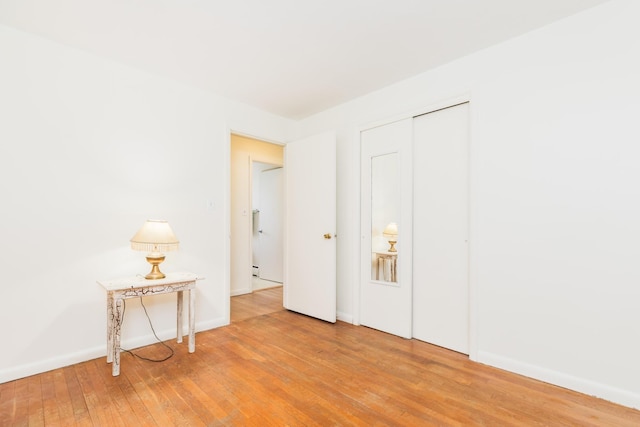 18 Riverdale Ave, Dover, NH 03820 - spare room with wood-type flooring and baseboards