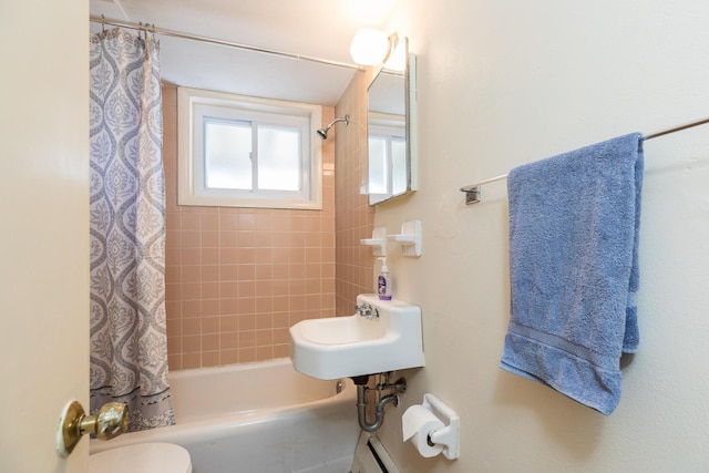 18 Riverdale Ave, Dover, NH 03820 - full bathroom featuring shower / bath combo with shower curtain, a sink, and toilet