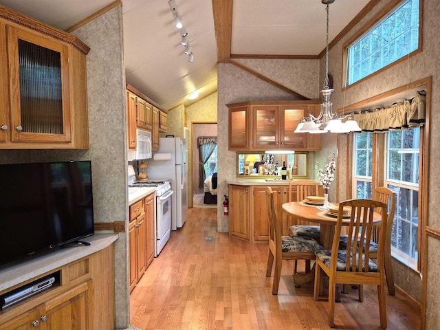 113 Oak Ln Unit 113, Wakefield, NH 03830 - kitchen with white appliances, light wood finished floors, plenty of natural light, lofted ceiling, and ornamental molding