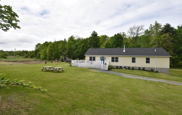 3900 Jersey St, Panton, VT 05491 - view of front of property featuring a deck and a front yard