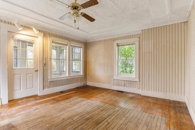 25 Eames St, Northumberland, NH 03582 - spare room featuring hardwood / wood-style floors, baseboards, ceiling fan, and an ornate ceiling