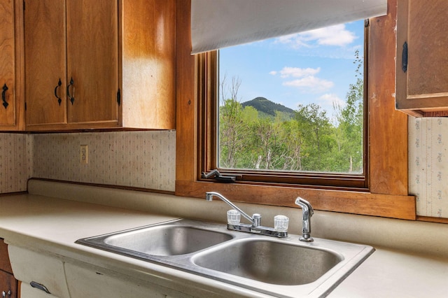 25 Eames St, Northumberland, NH 03582 - kitchen featuring a sink, brown cabinets, and light countertops