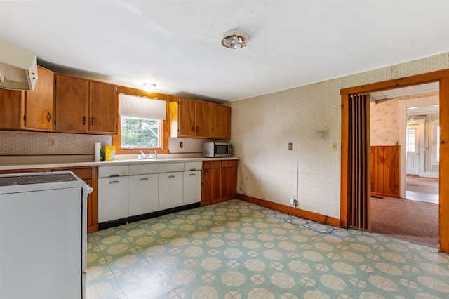 25 Eames St, Northumberland, NH 03582 - kitchen with wallpapered walls, stove, stainless steel microwave, ventilation hood, and light countertops