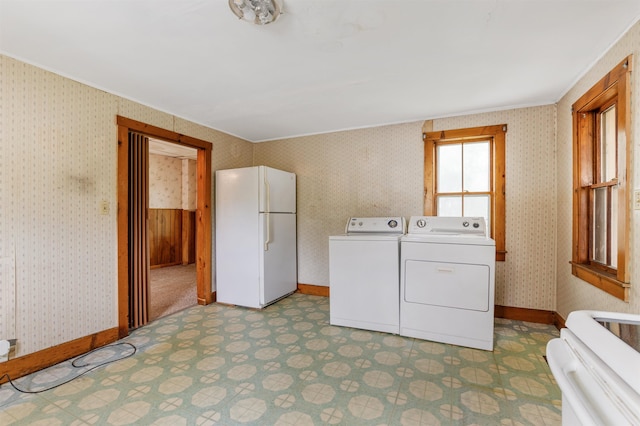 25 Eames St, Northumberland, NH 03582 - laundry room featuring washer and clothes dryer, baseboards, ornamental molding, and wallpapered walls