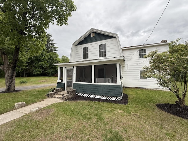 19 Gambier St, Claremont, NH 03743 - view of front of house featuring a sunroom and a front yard
