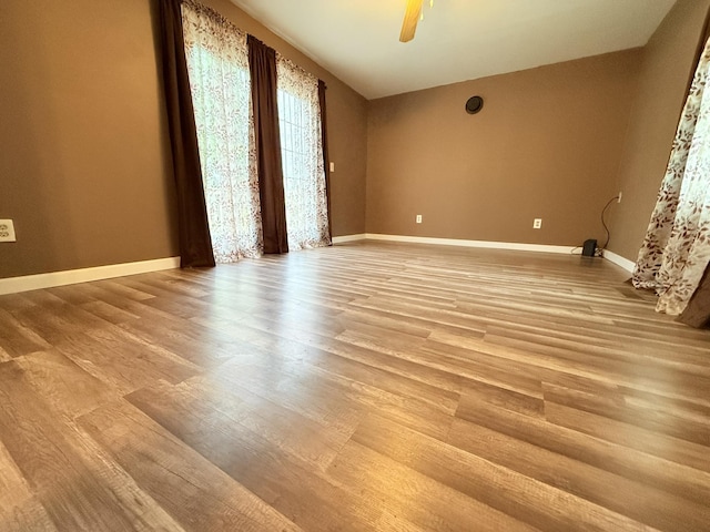 19 Gambier St, Claremont, NH 03743 - empty room featuring light wood-style floors, baseboards, and ceiling fan