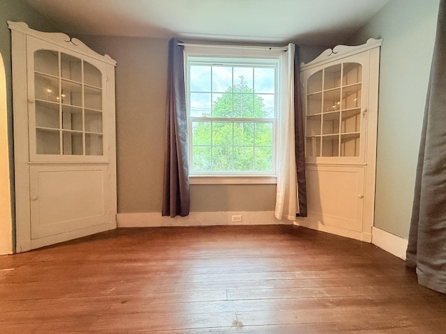 19 Gambier St, Claremont, NH 03743 - unfurnished dining area with hardwood / wood-style flooring and baseboards