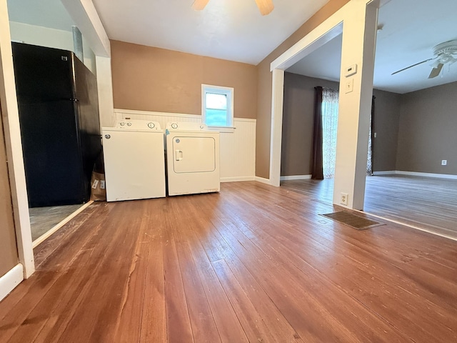 19 Gambier St, Claremont, NH 03743 - laundry area with a ceiling fan, hardwood / wood-style floors, and a wainscoted wall