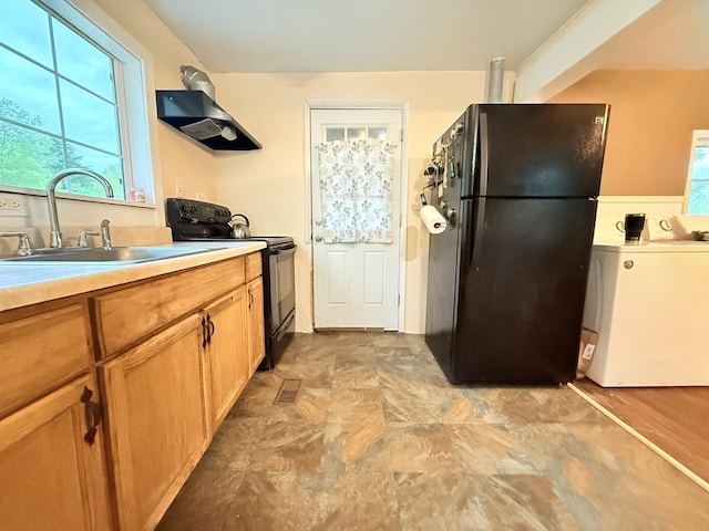 19 Gambier St, Claremont, NH 03743 - kitchen with black appliances, a sink, light countertops, and light stone finish floors