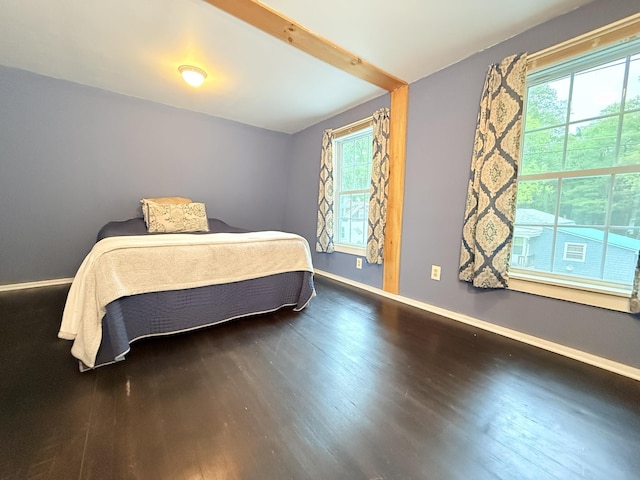 19 Gambier St, Claremont, NH 03743 - bedroom with wood finished floors, baseboards, and vaulted ceiling