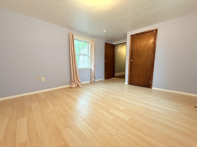 19 Gambier St, Claremont, NH 03743 - empty room with light wood-type flooring and baseboards