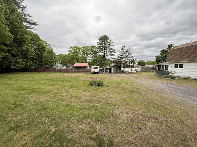 19 Gambier St, Claremont, NH 03743 - view of yard with a carport, dirt driveway, and an outbuilding