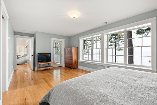 8 Wisteria Ln, Eliot, ME 03903 - bedroom with baseboards and wood finished floors