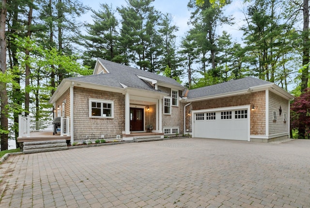 8 Wisteria Ln, Eliot, ME 03903 - view of front of house featuring driveway, a garage, and roof with shingles